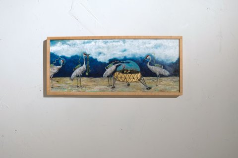 Panoramic oil on linen painting of sandhill cranes scavenging parts from a domed spacecraft on sandy ground, set against a deep blue sky with white clouds.